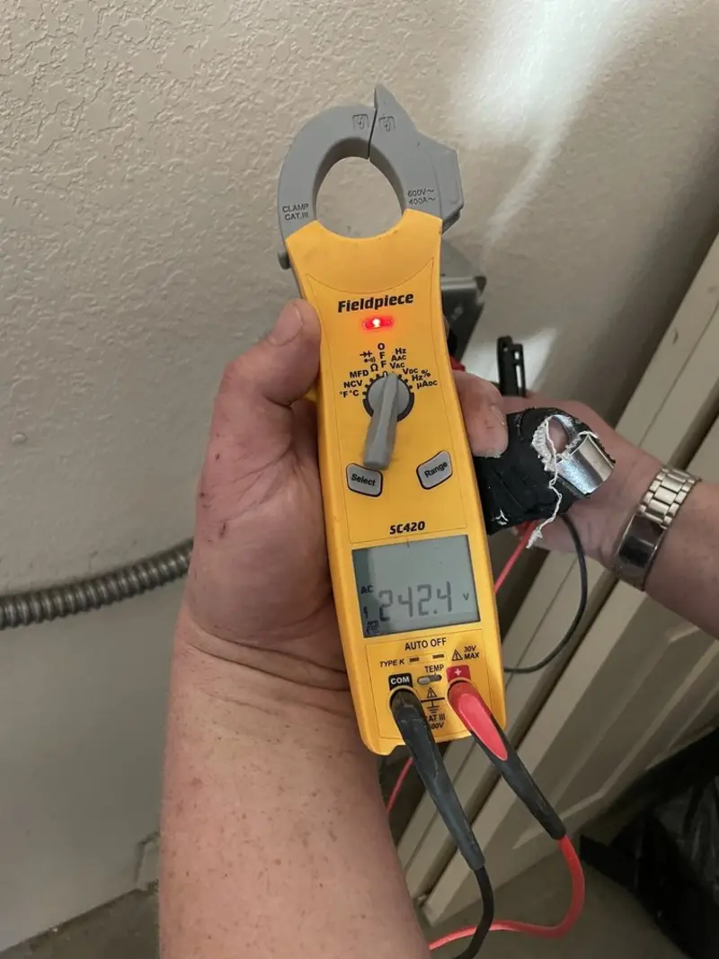 Voltage testing with clamp meter during Aluminum Wiring Replacement in Andover